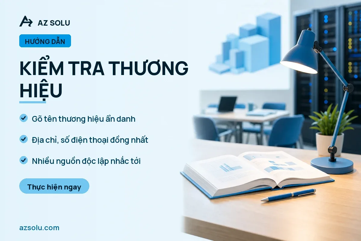 Kiểm tra thương hiệu — Bàn làm việc với sách mở, đèn bàn và chậu cây, phía sau có máy tính và biểu đồ.